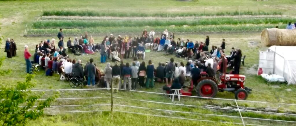 Through songs and sharings, retreatants declare their love for Mother Earth at a be-in on the Happy Farm.